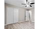 Bedroom featuring a closet, wood floors, and an overhead ceiling fan at 2617 Peggy Sue Ln, Morrow, GA 30260