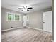 Bright bedroom features a ceiling fan, hardwood floors, and natural light at 2617 Peggy Sue Ln, Morrow, GA 30260