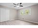 Bedroom featuring a closet, wood floors, and an overhead ceiling fan at 2617 Peggy Sue Ln, Morrow, GA 30260