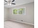 Bedroom featuring hard surface floors, ceiling fan, and natural light at 2617 Peggy Sue Ln, Morrow, GA 30260