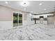 Bright kitchen featuring white cabinets, stone countertops, and stainless steel appliances at 2617 Peggy Sue Ln, Morrow, GA 30260