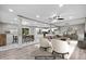 Open-concept living and dining area with wood floors, recessed lighting, and white kitchen cabinets at 2617 Peggy Sue Ln, Morrow, GA 30260