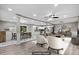 Open concept living room showcasing a modern kitchen, dining area, and comfortable seating at 2617 Peggy Sue Ln, Morrow, GA 30260