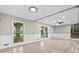 Bright and airy living area featuring wood floors, wainscoting, recessed lighting and plenty of natural light from exterior windows at 2617 Peggy Sue Ln, Morrow, GA 30260