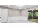 Inviting living space with recessed lighting, marble floors, wainscoting, and a sliding glass door that offers access to an outdoor space at 2617 Peggy Sue Ln, Morrow, GA 30260