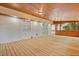 Enclosed porch features wood floors, brick accents, and access to the home at 2617 Peggy Sue Ln, Morrow, GA 30260