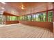 Enclosed porch featuring wood floors and views of mature trees at 2617 Peggy Sue Ln, Morrow, GA 30260