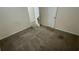 Bedroom featuring wall-to-wall carpeting and basic features with two doors at 6344 Fitzgerald Ln, Austell, GA 30168