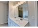 Bright bathroom with double sinks and large mirror at 1431 Winding Ridge Trl, Buford, GA 30548