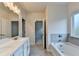 Modern bathroom features double sinks, a soaking tub, and tiled accents at 1431 Winding Ridge Trl, Buford, GA 30548