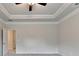 Spacious carpeted bedroom featuring a ceiling fan and neutral color palette at 1431 Winding Ridge Trl, Buford, GA 30548