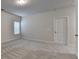 Bright bedroom with carpet floors, neutral walls, and a window for natural light at 1431 Winding Ridge Trl, Buford, GA 30548