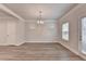 Open dining area with natural lighting and light wood flooring at 1431 Winding Ridge Trl, Buford, GA 30548
