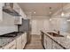 Modern kitchen features granite counters, stainless steel appliances and subway tile backsplash at 1431 Winding Ridge Trl, Buford, GA 30548