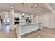 Spacious kitchen with granite countertops, stainless steel appliances, and light wood flooring at 1431 Winding Ridge Trl, Buford, GA 30548