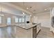 Open concept kitchen with granite countertops, stainless steel appliances, and adjacent living area at 1431 Winding Ridge Trl, Buford, GA 30548