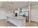 Bright kitchen features stainless steel appliances, granite countertops, and a large kitchen island at 1431 Winding Ridge Trl, Buford, GA 30548