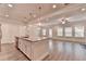 Open kitchen boasts stainless appliances, granite countertops, and access to the living room at 1431 Winding Ridge Trl, Buford, GA 30548
