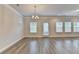 Bright living area with natural lighting, light neutral walls, and light wood flooring at 1431 Winding Ridge Trl, Buford, GA 30548