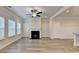 Living room with a fireplace, neutral paint and flooring at 1431 Winding Ridge Trl, Buford, GA 30548