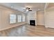 Living room features a fireplace and neutral decor at 1431 Winding Ridge Trl, Buford, GA 30548