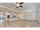 Bright, open-concept living area with modern kitchen, hardwood floors, and natural light at 1431 Winding Ridge Trl, Buford, GA 30548