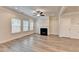 Open-concept living area with a fireplace and abundant natural light at 1431 Winding Ridge Trl, Buford, GA 30548