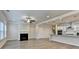Living room features a fireplace that flows into the kitchen and dining area at 1431 Winding Ridge Trl, Buford, GA 30548