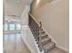 Carpeted stairs lead to the upper level of the home at 1431 Winding Ridge Trl, Buford, GA 30548