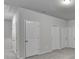 Upstairs hallway with doors leading to bedrooms and other areas of the home at 1431 Winding Ridge Trl, Buford, GA 30548