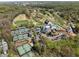 An aerial view featuring tennis courts, a golf course, and a recreational facility with a pool at 200 Heaton Park Dr, Decatur, GA 30030