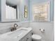 Charming bathroom with a marble countertop, white wainscoting, and soft blue walls for a relaxing atmosphere at 200 Heaton Park Dr, Decatur, GA 30030
