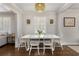 Traditional dining room features wood floors, white walls, bright natural light and modern decor at 200 Heaton Park Dr, Decatur, GA 30030