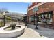 Restaurant Savi Provisions shows a nice outdoor eating area with fountain and vintage streetlights at 200 Heaton Park Dr, Decatur, GA 30030