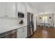 Gourmet kitchen featuring stainless steel appliances and views into the dining area at 200 Heaton Park Dr, Decatur, GA 30030