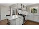 Bright kitchen boasts stainless steel appliances, shaker cabinets, and eat-in breakfast bar at 200 Heaton Park Dr, Decatur, GA 30030