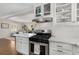Charming kitchen boasts stainless steel appliances, white subway tile, and bar seating at 200 Heaton Park Dr, Decatur, GA 30030