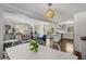 Open floor plan with living room, dining area, and kitchen with white cabinets at 200 Heaton Park Dr, Decatur, GA 30030