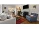 Cozy living room with fireplace, hardwood floors, and an open view to other living areas at 200 Heaton Park Dr, Decatur, GA 30030