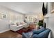 Bright living room with hardwood floors, plantation shutters, and seamless access to the dining room at 200 Heaton Park Dr, Decatur, GA 30030