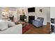 Cozy living room with fireplace, hardwood floors, and an open view to other living areas at 200 Heaton Park Dr, Decatur, GA 30030