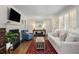 Bright living room with hardwood floors, plantation shutters, and comfortable neutral-toned furnishings at 200 Heaton Park Dr, Decatur, GA 30030