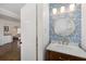 Charming powder room with designer wallpaper, modern lighting and faucet at 200 Heaton Park Dr, Decatur, GA 30030