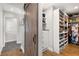 Walk-in closet featuring custom shelving and storage with barn door at 200 Heaton Park Dr, Decatur, GA 30030