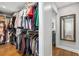 Spacious walk-in closet with custom shelving and hardwood floors, offering ample storage and a full-length mirror at 200 Heaton Park Dr, Decatur, GA 30030