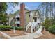 A well-maintained exterior view of the building with stairs and mature landscaping around the building at 2016 River Heights Se Walk, Marietta, GA 30067