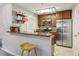 Well-lit kitchen area with stainless steel appliances and breakfast bar at 2016 River Heights Se Walk, Marietta, GA 30067