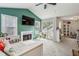 Cozy living room features a fireplace, high ceilings, and sliding glass door at 2016 River Heights Se Walk, Marietta, GA 30067