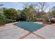 Outdoor pool is covered and protected for the off-season with mature trees, plants, and a patio area surrounding it at 2016 River Heights Se Walk, Marietta, GA 30067