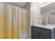 Updated bathroom featuring a blue vanity and a shower with a stylish curtain at 331 Parkview Manor Dr, Tucker, GA 30084